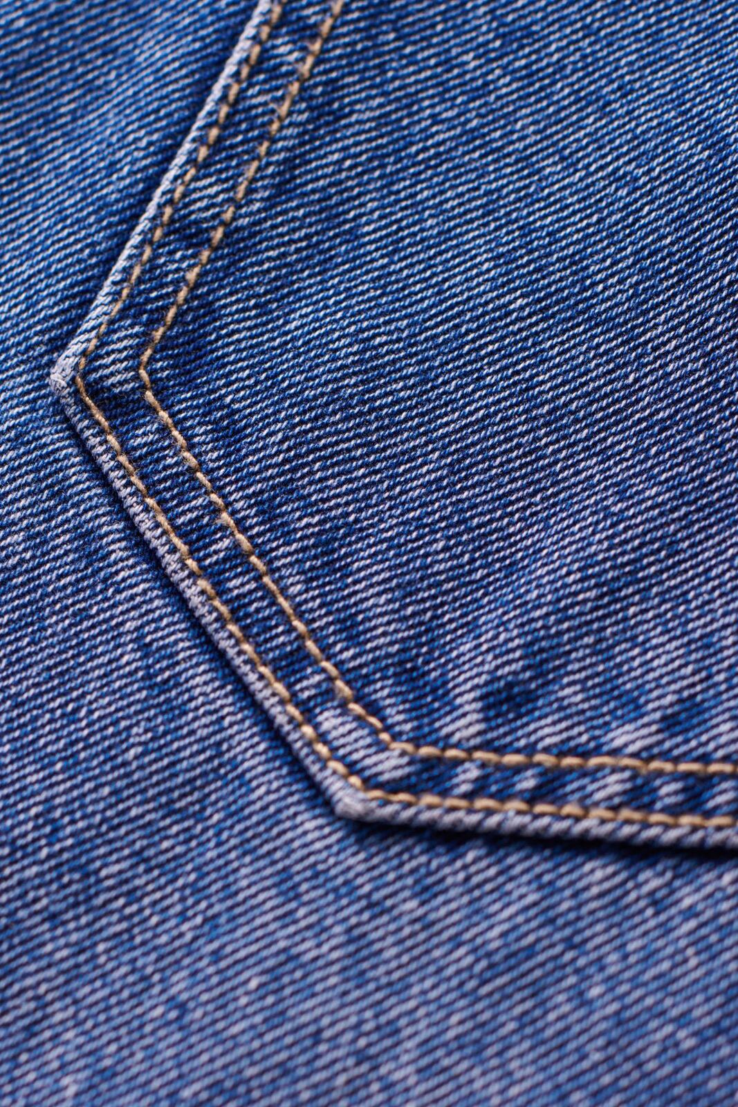Close-up of denim stitching and construction