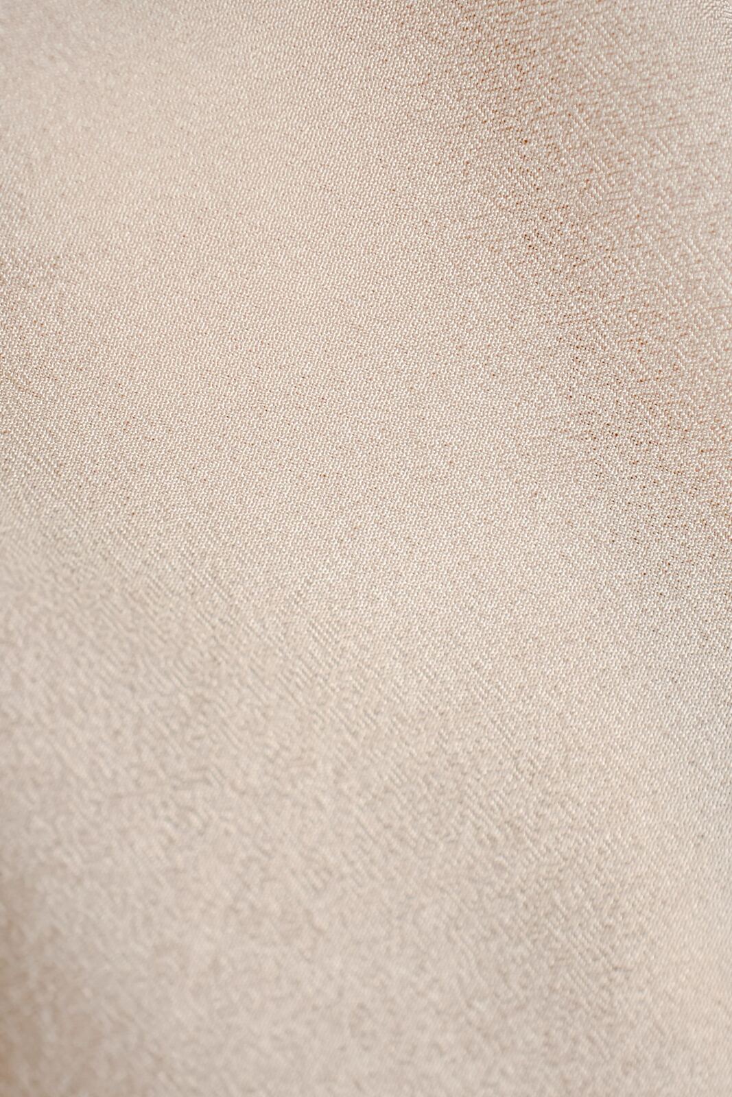 Close-up of folded beige fabric